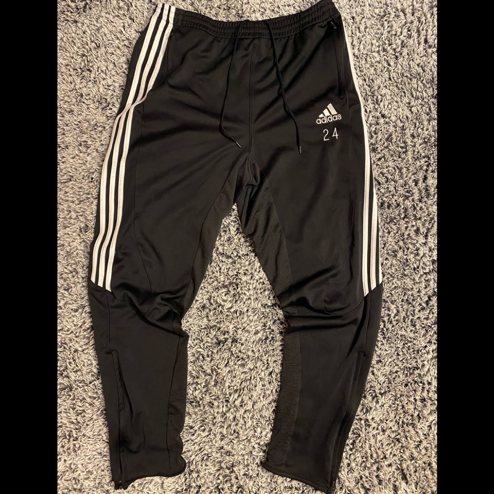 Adidas track pants .